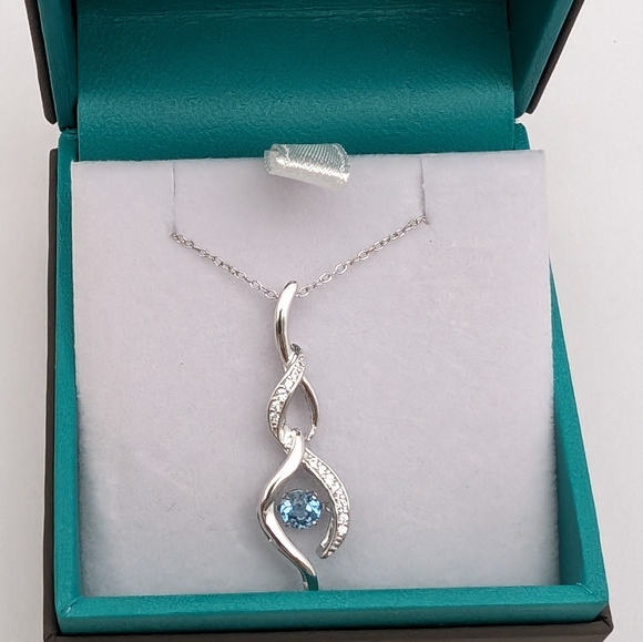 Sterling Silver Round Cut Sparkling Blue Topaz Infinity Pendant Necklace - Picture 6 of 9
